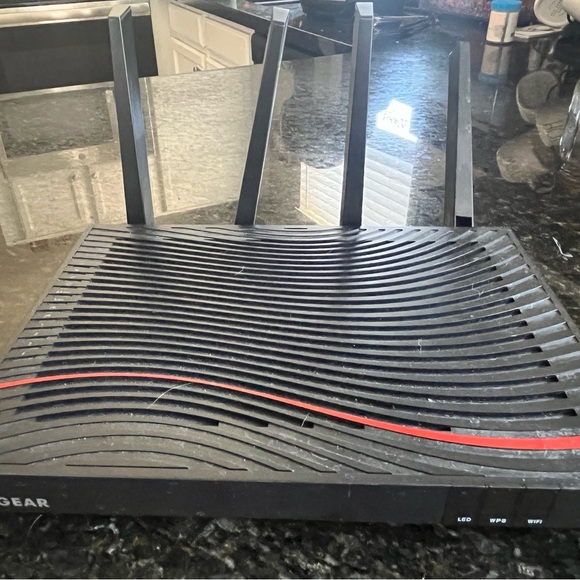 Netgear Black Wireless Router with Ribbed Design and LED Indicators - Picture 2 of 3